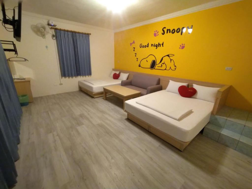 Postel nebo postele na pokoji v ubytování Penghu Le You You Homestay