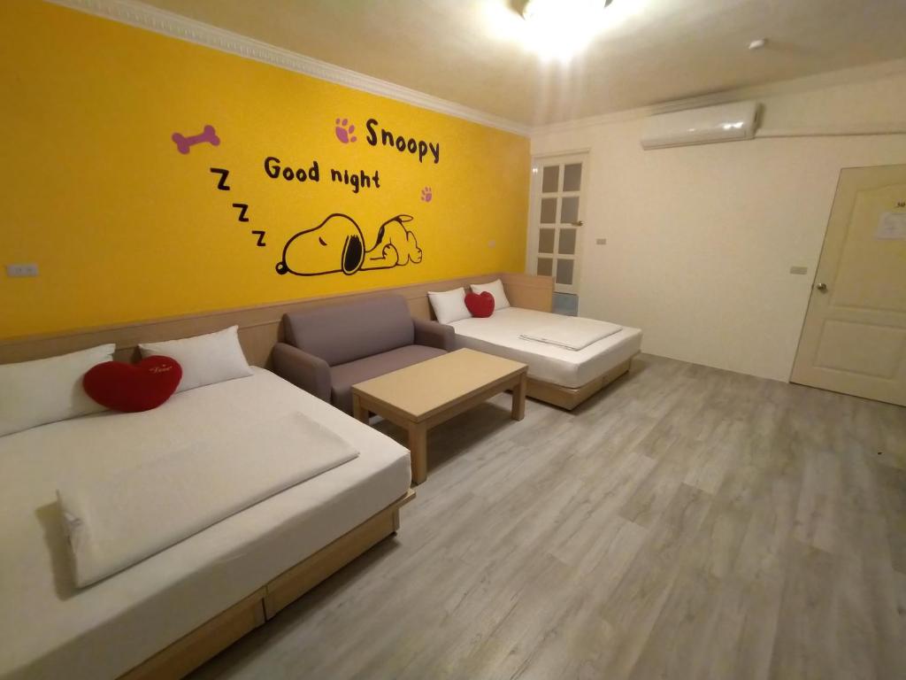 Postel nebo postele na pokoji v ubytování Penghu Le You You Homestay
