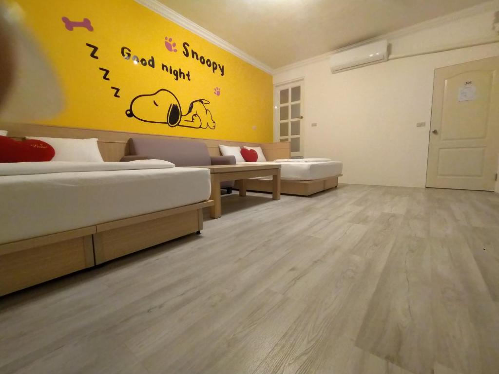Postel nebo postele na pokoji v ubytování Penghu Le You You Homestay