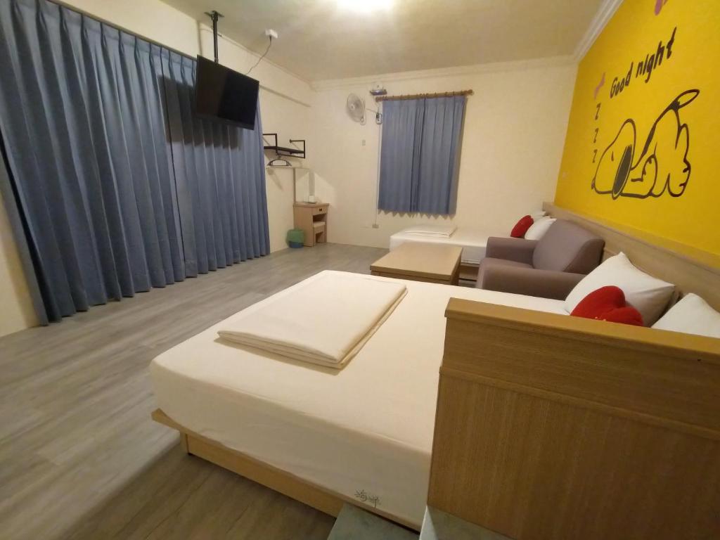 Postel nebo postele na pokoji v ubytování Penghu Le You You Homestay