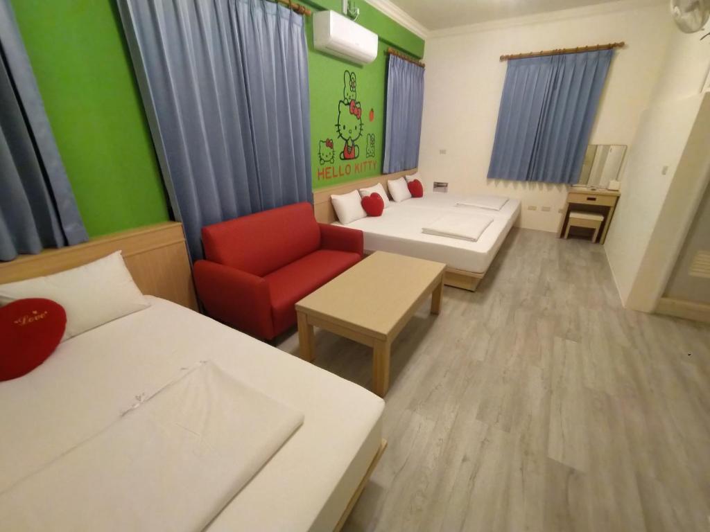 Postel nebo postele na pokoji v ubytování Penghu Le You You Homestay