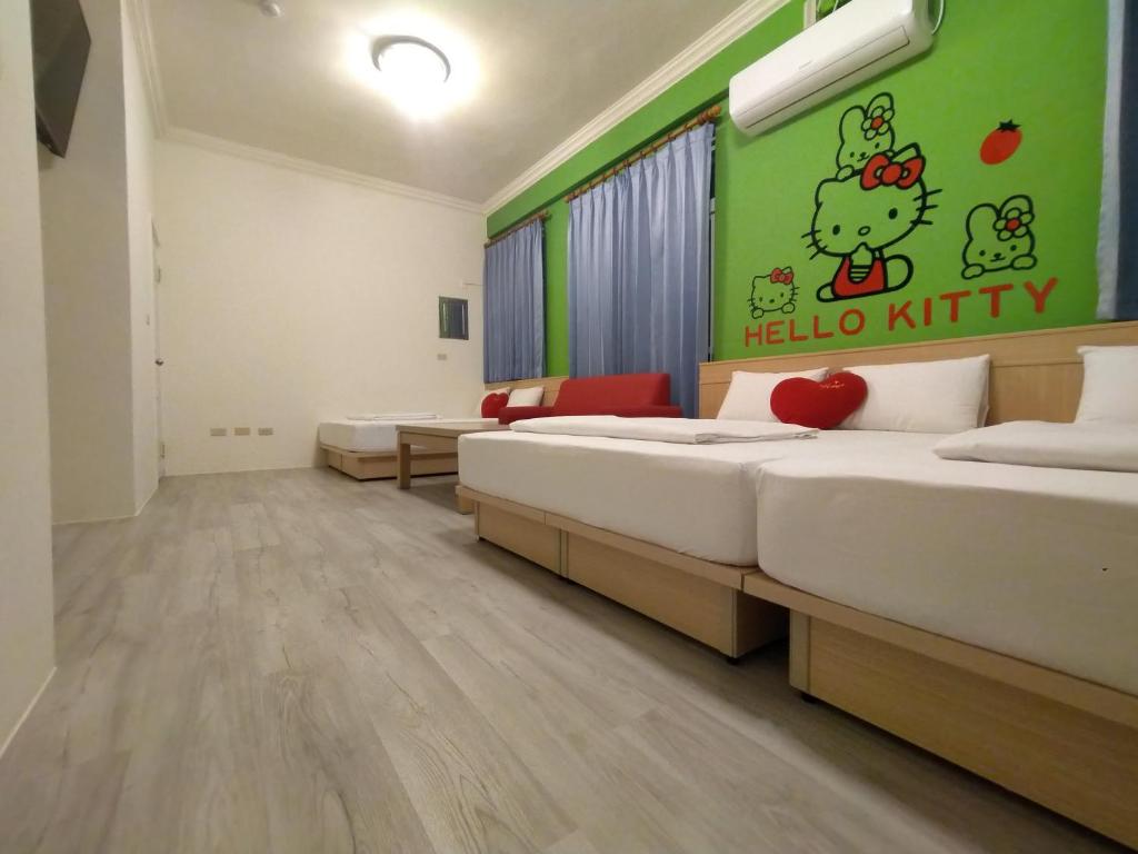 Postel nebo postele na pokoji v ubytování Penghu Le You You Homestay