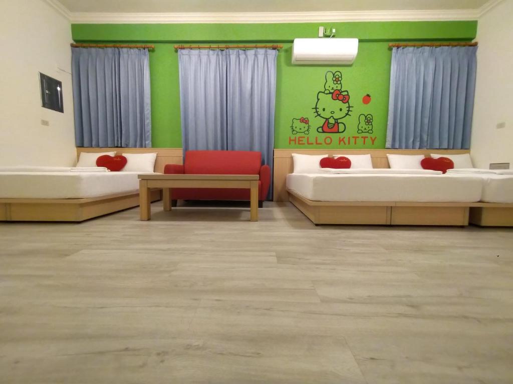 Postel nebo postele na pokoji v ubytování Penghu Le You You Homestay