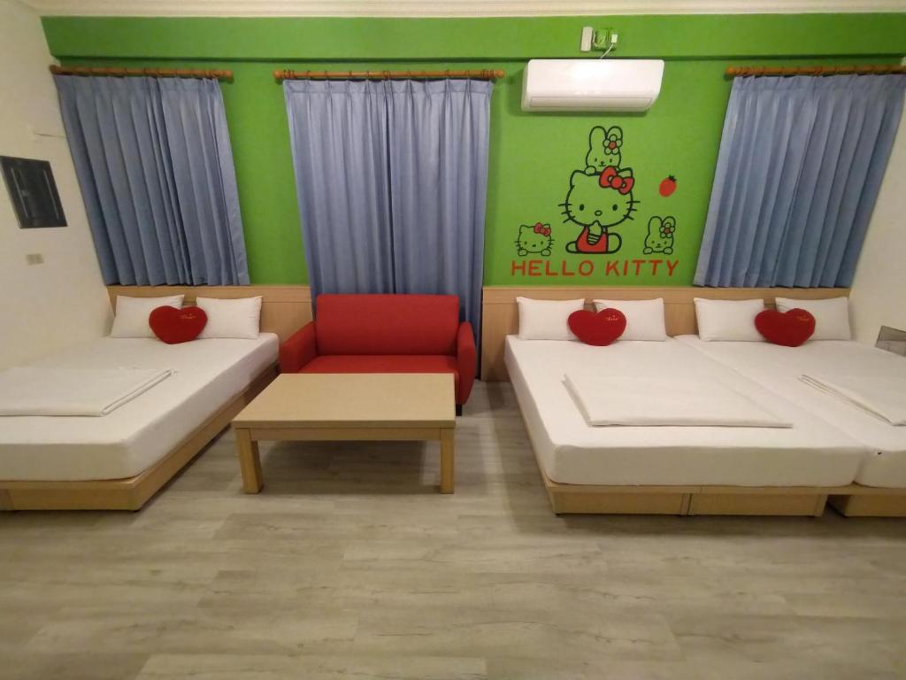 Postel nebo postele na pokoji v ubytování Penghu Le You You Homestay