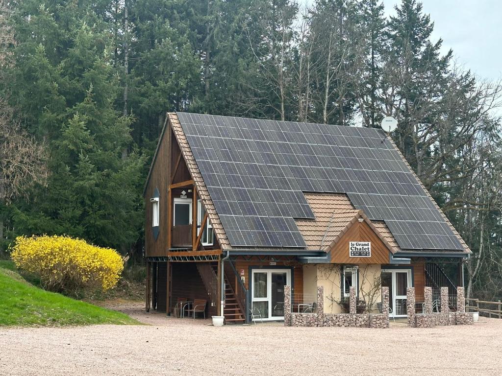 a house with solar panels on the roof at Du côté de chez Sam in Andelaroche