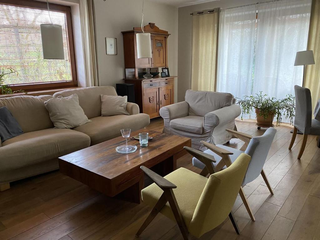 a living room with a couch and a table and chairs at Holiday Home Wieliczka by Interhome in Wieliczka
