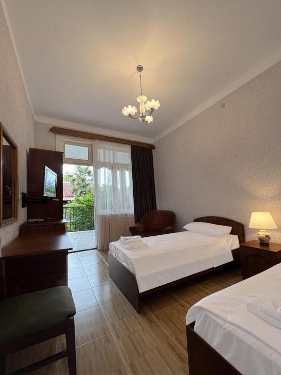 Postel nebo postele na pokoji v ubytování Savane hotel