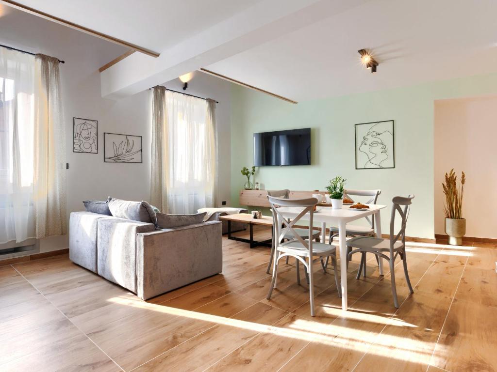 a living room with a couch and a table at Studio Zanet by Interhome in Fažana