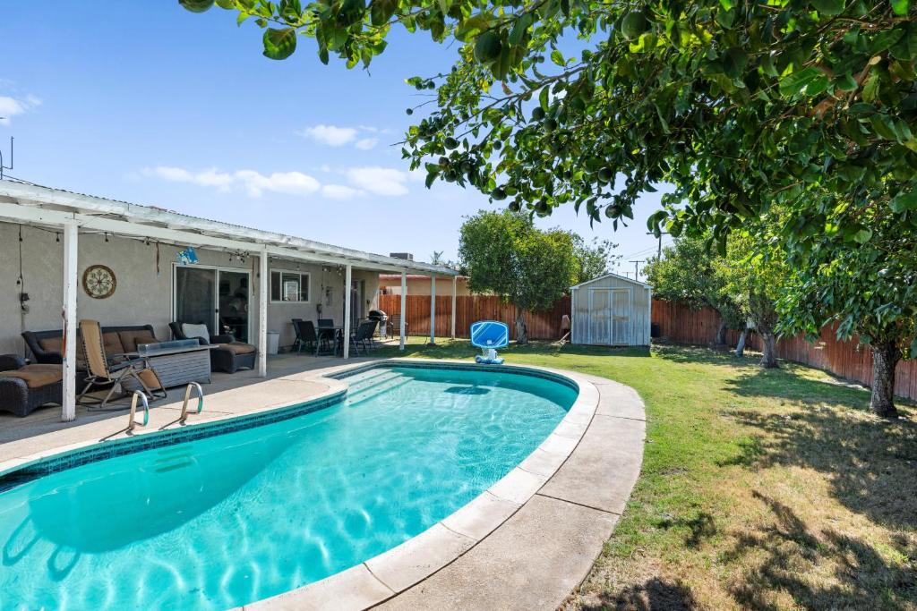 a swimming pool in the backyard of a house at Indio Home with Heated Pool 2 Mi to Coachella! in Indio