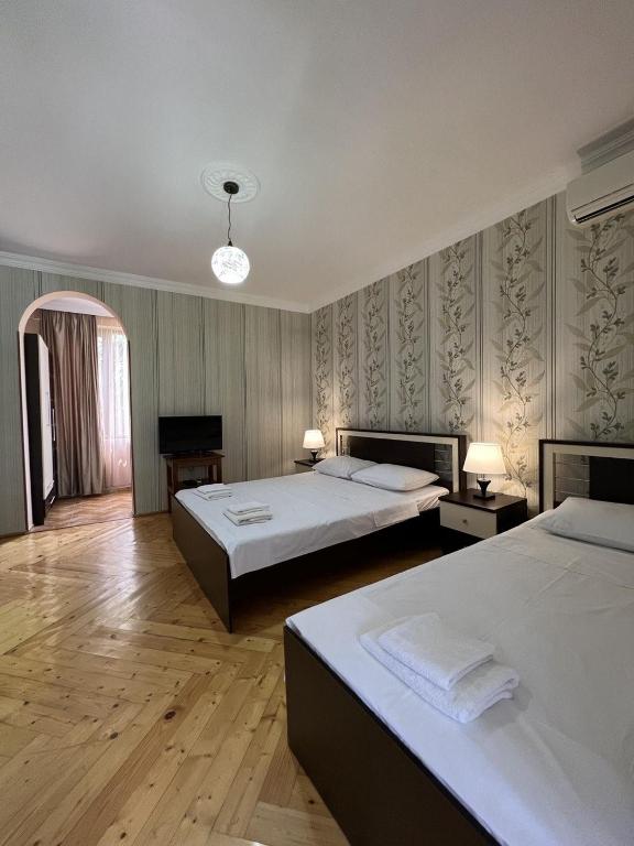 Postel nebo postele na pokoji v ubytování Savane hotel
