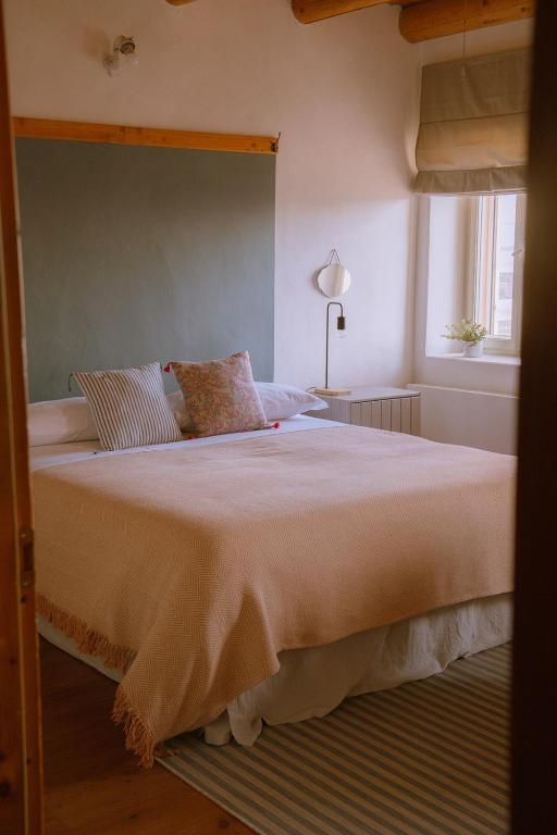 Postel nebo postele na pokoji v ubytování Dimora Valverde B&B