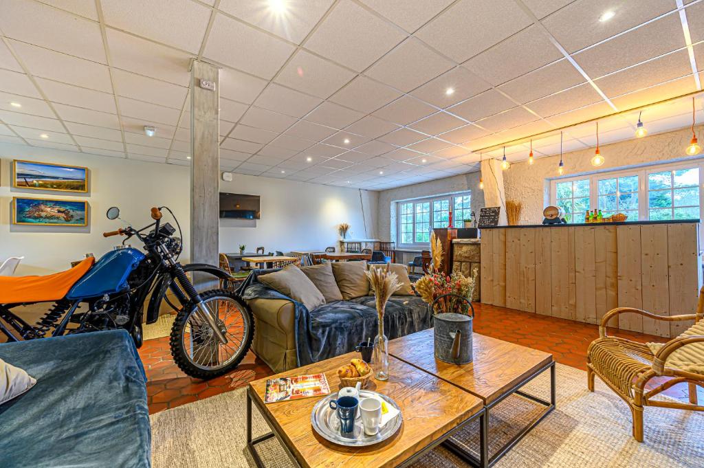 a living room with a motorcycle parked in it at Naéco Erdeven in Erdeven