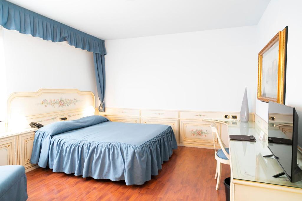 Postel nebo postele na pokoji v ubytování Melas Hotel