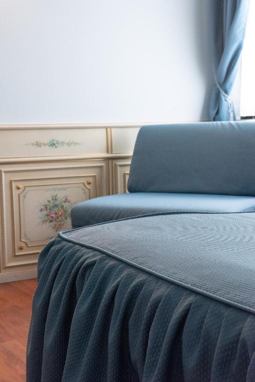 Postel nebo postele na pokoji v ubytování Melas Hotel
