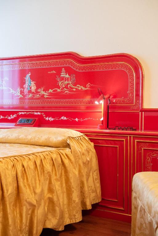 Postel nebo postele na pokoji v ubytování Melas Hotel