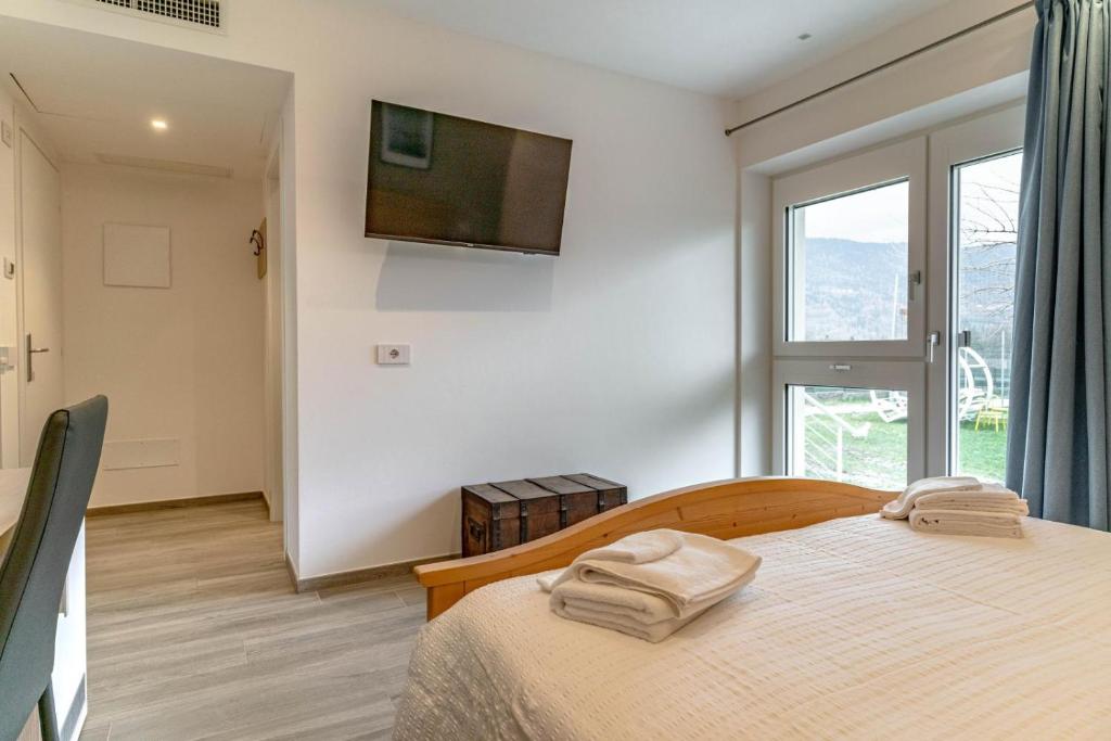 Postel nebo postele na pokoji v ubytování B&B A Un Passo Dal Lago, Caldonazzo