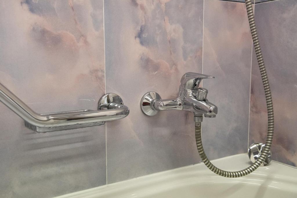 Koupelna v ubytování Melas Hotel