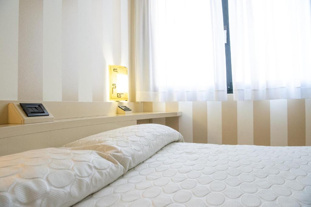 Postel nebo postele na pokoji v ubytování Melas Hotel