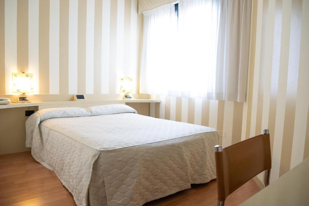 Postel nebo postele na pokoji v ubytování Melas Hotel