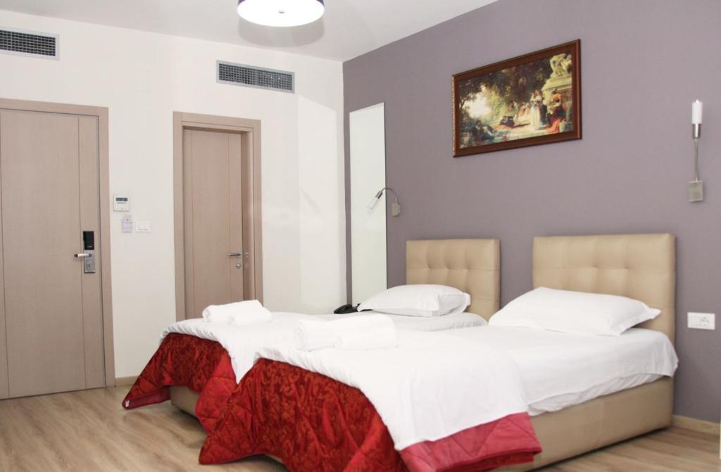 Postel nebo postele na pokoji v ubytování Hotel Relax