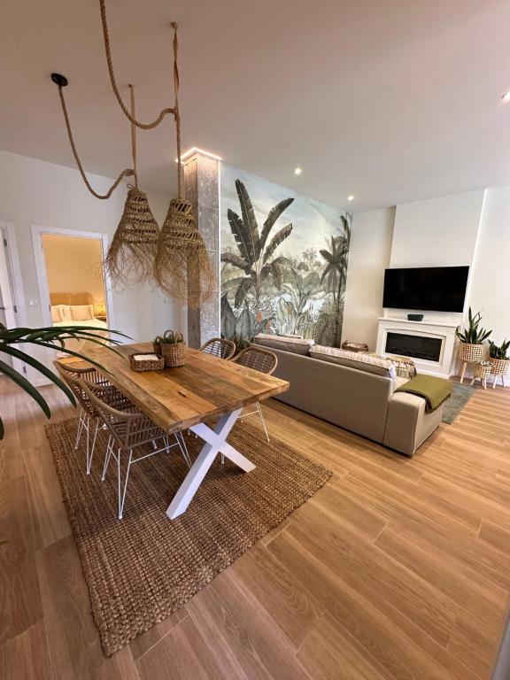 a living room with a table and a couch at Paraíso Rias Baixas in Pontevedra