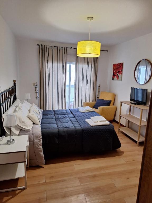Postel nebo postele na pokoji v ubytování APARTAMENTO VILLA 3