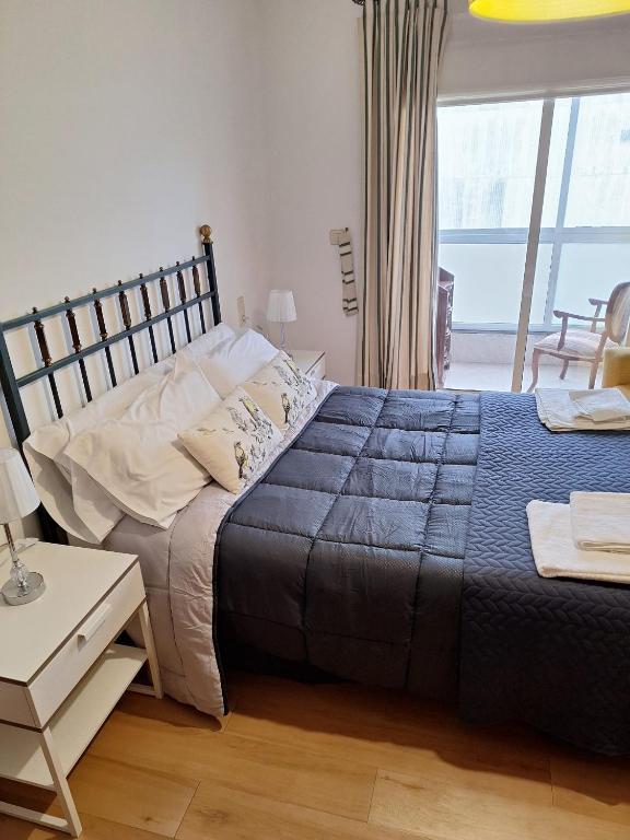 Postel nebo postele na pokoji v ubytování APARTAMENTO VILLA 3