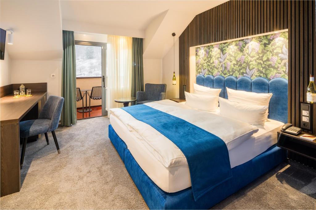 Postel nebo postele na pokoji v ubytování Hotel Heiligenstein