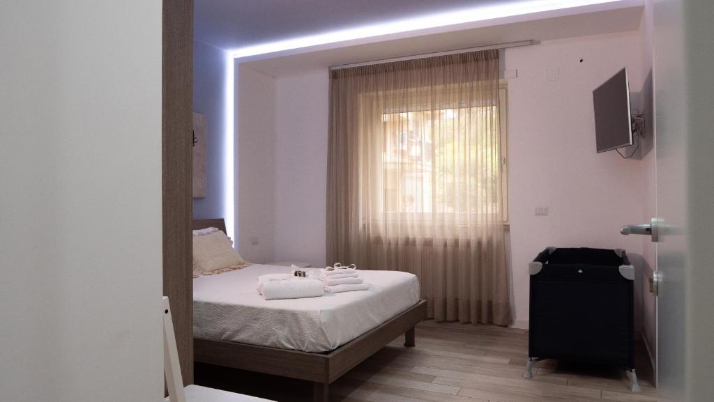 A bed or beds in a room at Wanderlust Guesthouse
