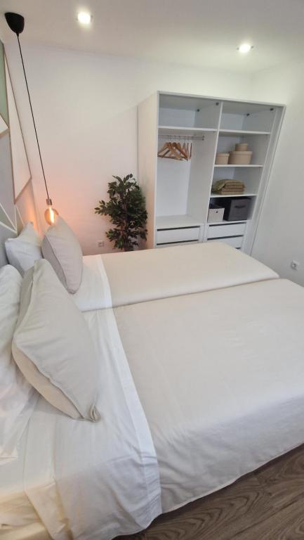 Postel nebo postele na pokoji v ubytování Santa Cruz Villas