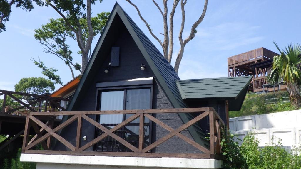 a house with a black roof and a wooden porch at LaVilla - Vacation STAY 27602v in Nobotate