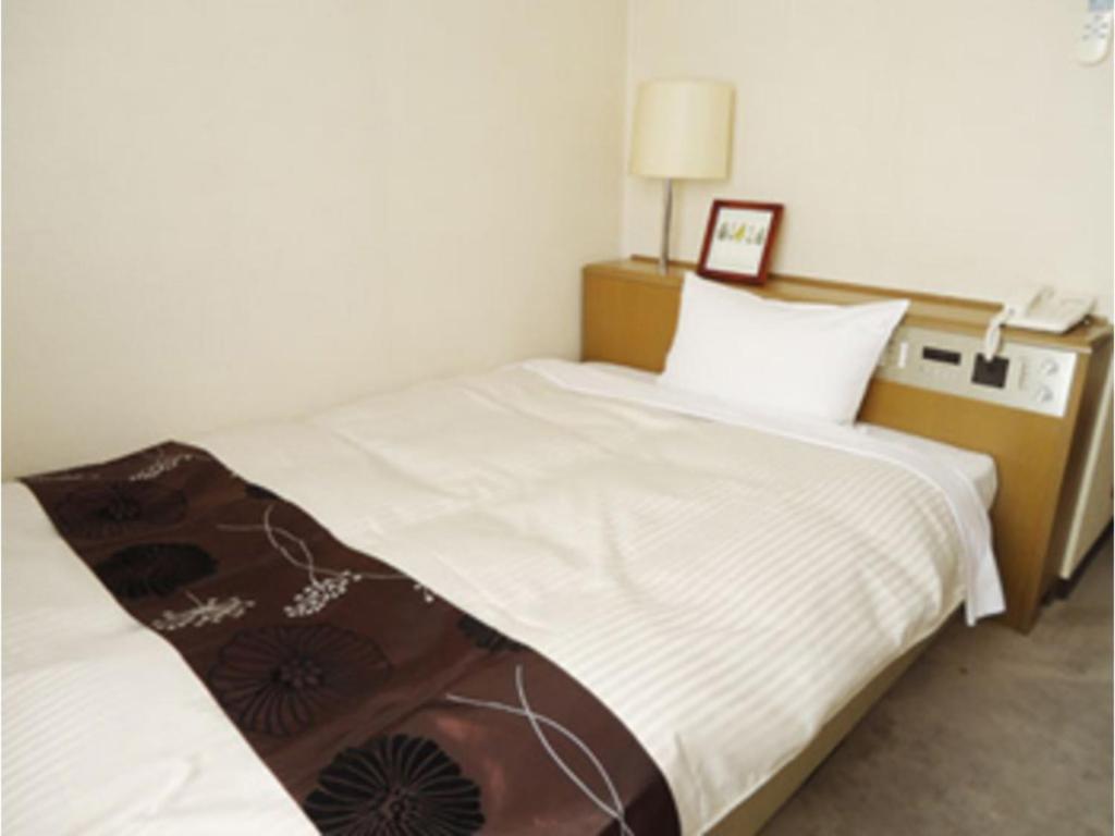 Giường trong phòng chung tại Hotel Tohaku INN - Vacation STAY 01144v