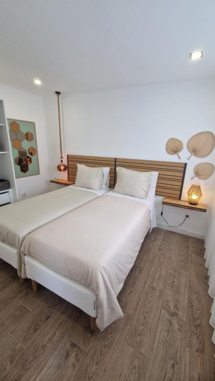 Postel nebo postele na pokoji v ubytování Santa Cruz Villas