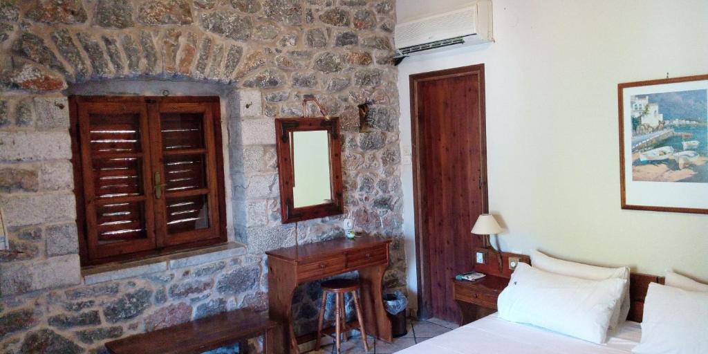 Postel nebo postele na pokoji v ubytování Marathos Bay