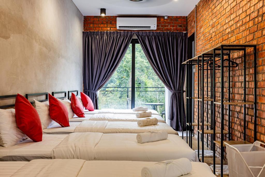 Postel nebo postele na pokoji v ubytování Sebayu Retreat Gopeng