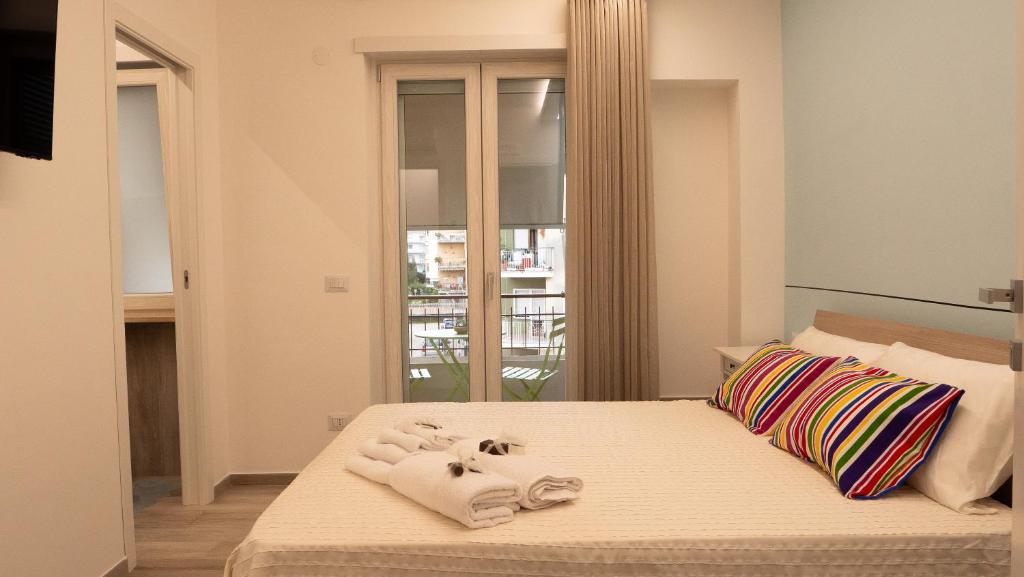 A bed or beds in a room at Wanderlust Guesthouse