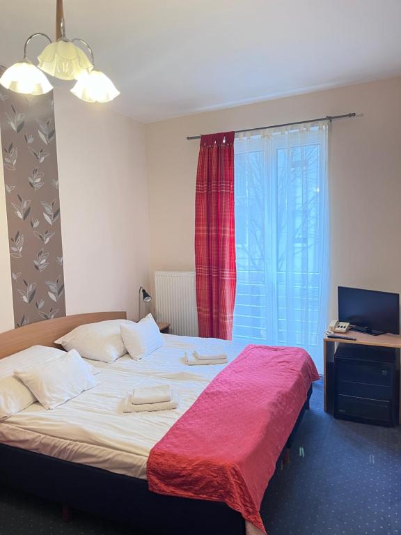 Postel nebo postele na pokoji v ubytování Hotel Rose City