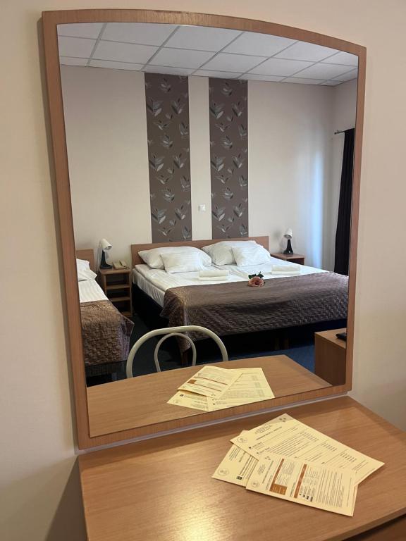 Postel nebo postele na pokoji v ubytování Hotel Rose City