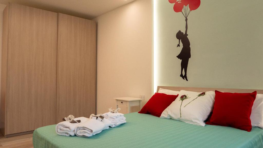 A bed or beds in a room at Wanderlust Guesthouse