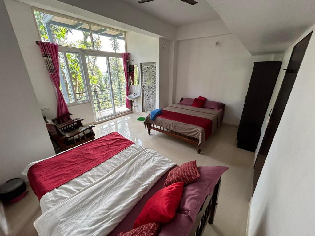 a bedroom with a bed and a large window at Sana Riverside in Madikeri