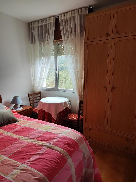 Postel nebo postele na pokoji v ubytování Casa da Fontiña