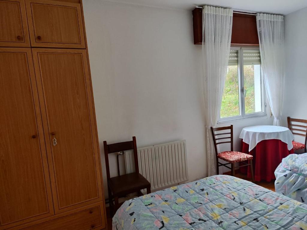 Postel nebo postele na pokoji v ubytování Casa da Fontiña