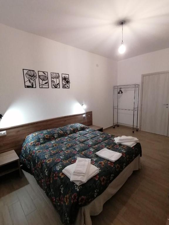 Postel nebo postele na pokoji v ubytování CLASS ROOMS AFFITTACAMERE
