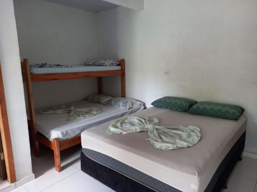 Postel nebo postele na pokoji v ubytování Pousada Beija Flor