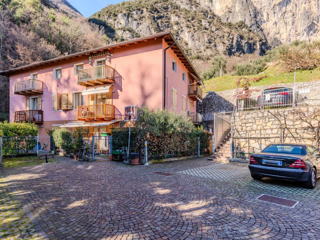 a house with a car parked in front of it at Apartment Welcome 2 Riva by Interhome in Riva del Garda