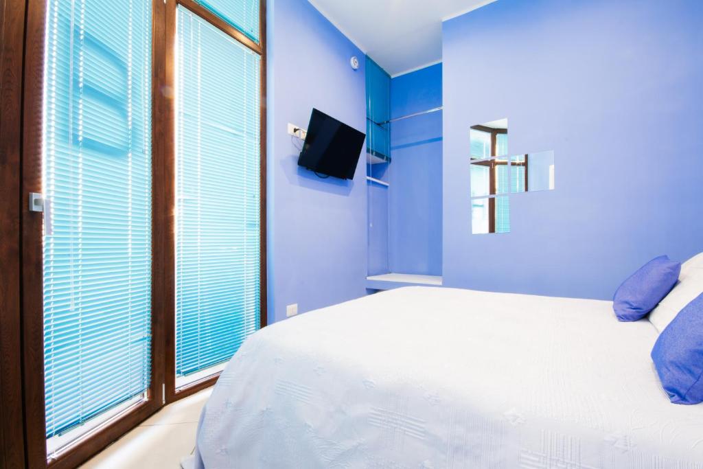 Postel nebo postele na pokoji v ubytování Barone Home