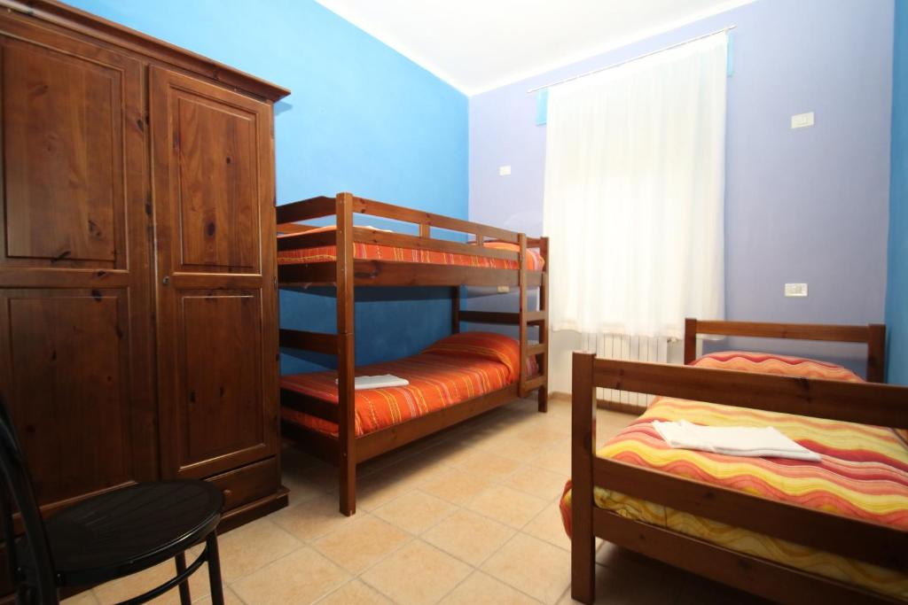 Ostello Del Volo - Quadruple Room With Shared Bathroom