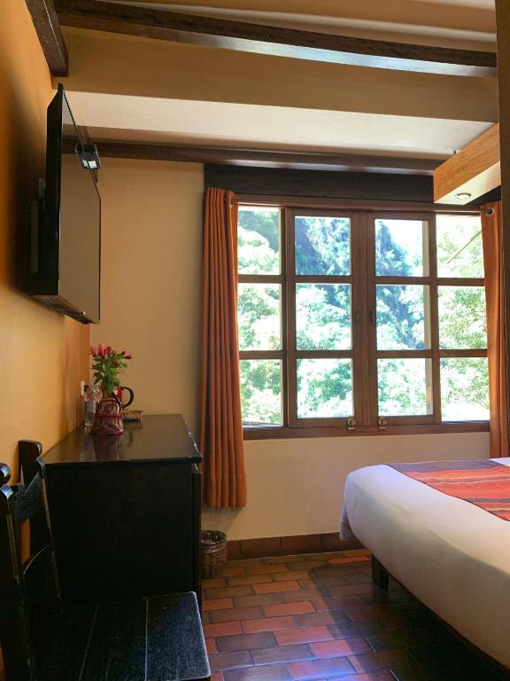 Postel nebo postele na pokoji v ubytování Panorama B&B