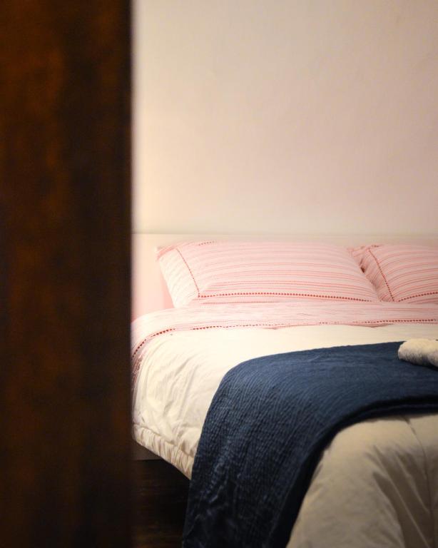 Łóżko lub łóżka w pokoju w obiekcie MANZONI 10 APARTAMENT