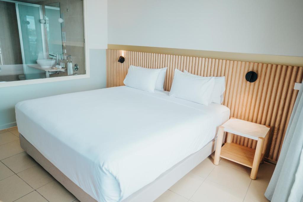 Postel nebo postele na pokoji v ubytování Grand Hotel & Casino